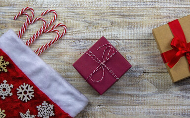 Christmas, rosette on a wooden background of New Year's toys gifts.