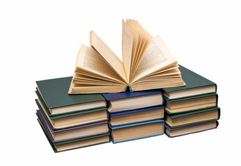An open book lying on top of books, isolated on a white background.