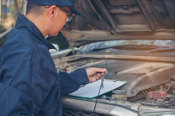 Fototapeta premium Mechanic car service auto garage in automotive mobile center. Technician workshop repair engine motor vehicles service mechanical engineering business. Automobile mechanic hands car repairs technic
