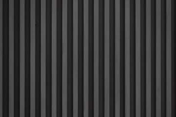 black steel stried background and texture. metal wall.