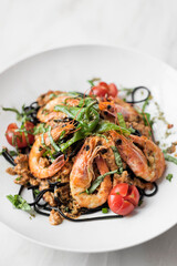 black squid ink spaghetti pasta with shrimp and mixed vegetables