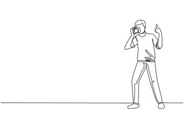Single continuous line drawing photographer standing, thumbs up gesture, holding photo camera and photographing. Creative profession or occupation. One line draw graphic design vector illustration