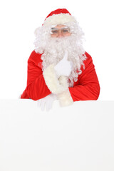 Crazy cheerful Santa Claus near copy space area, isolated over white background. Merry Christmas and New Year concept
