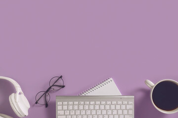 Online learning education, freelance and office work minimalistic flat lay. White headphones, notebook, computer keyboard, glasses and coffee cup on purple background.