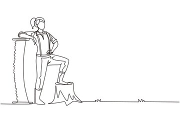 Continuous one line drawing beautiful woman lumberjack wearing suspender shirt, standing with big steel saw, posing with one foot on a tree stump. Single line draw design vector graphic illustration