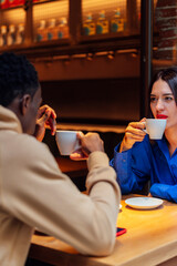 Couple drinking coffee happy chatting in cafe.