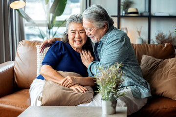 old senior asian retired couple enjoy talking conversation together on sofa with happiness laugh smile and joyful at home,asian old mature adult stay home quarantine period concept - Powered by Adobe