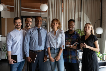 Portrait of happy successful diverse business team. Multiethnic employees of different ages, races...