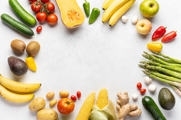 Gastronomic frame made of fresh vegetables and fruits . Top view, place inscription