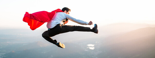 Man with superhero cape kicks kung fu. © MR.PLAY