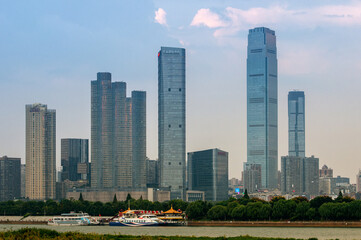 Fototapeta premium Urban skyscrapers under the rosy sky at nightfall;