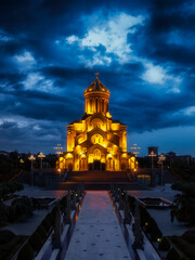 Cathedral on the background of blue night cloudy sky