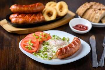 grilled sausage tasty fried egg and tomatoes