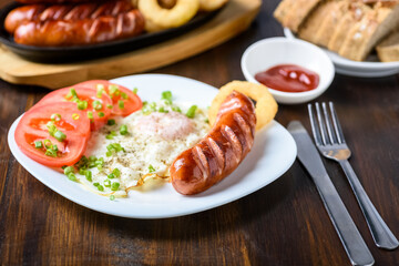 grilled sausage tasty fried egg and tomatoes