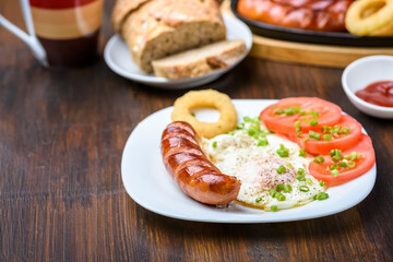 grilled sausage tasty fried egg and tomatoes
