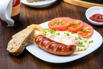 grilled sausage tasty fried egg and tomatoes