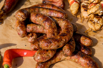Fried sausages on the counter. Street food festival. Close-up. Selective focus.
