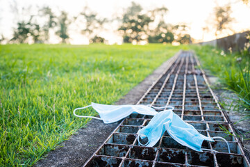Face mask on lawn during the corona pandemic.Mask and corona virus protection concept.