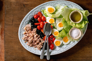 Fototapeta na wymiar Traditional nicoise salad with canned tuna fish