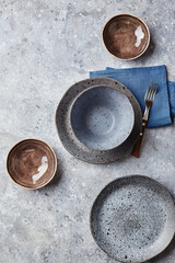 Food background. Empty plates on grey background. Top view, flatlay, copyspace