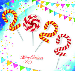 Christmas background 2022 of candy with snow and a Christmas tree