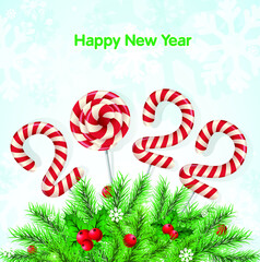 Christmas background 2022 of candy with snow and a Christmas tree