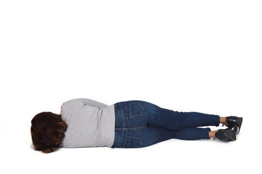 rear view of a woman lying on the floor on white background