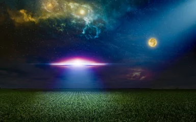 Zelfklevend Fotobehang Scenic sci-fi image - ufo inspect green grass field with bright spotlight in dark night sky. Nebula and full moon in starry sky. © IgorZh
