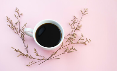 White ceramic cup with black coffee put on background