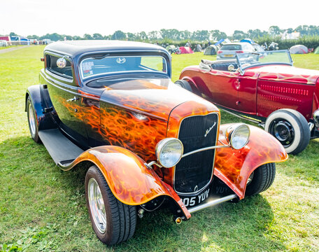 4x4 and camper van show 2021 in Stratford, Warwickshire, UK &ndash; September 2021. Front on view of a custom and hand built hot rod car with an airbrushed flames paintjob