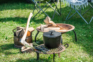 4x4 and camper van show 2021 in Stratford, Warwickshire, UK &ndash; September 2021. Cooking pot on metal stand and cooking accessories on the campsite at the annual Campervan show