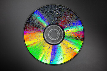 Art creation of light and water droplets on a dvd disk - stock photo