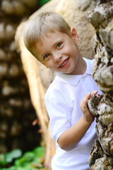 Portrait of young smiling boy in outdoors. - 459301230
