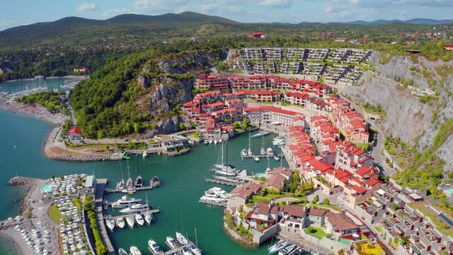 4k drone flight moving to the side footage (Ultra High Definition) of Marina di Portopiccolo, Golfo di, Trieste TS, Italy, Europe. Stunning summer scene of Portopiccolo Sistiana Beach.