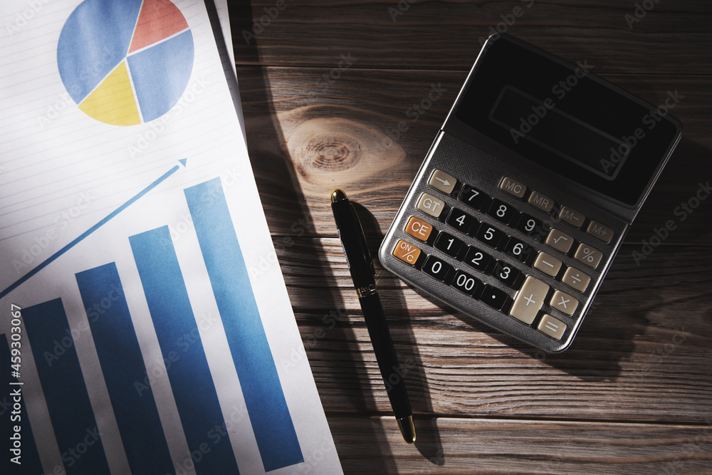 Poster statistical graphs and calculator with pen