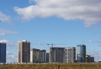 Construction of modern multi-storey buildings. Construction of a new city block. Buildings under...