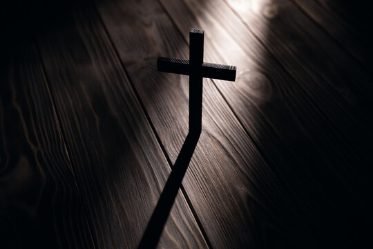 christian cross old wood on wooden background