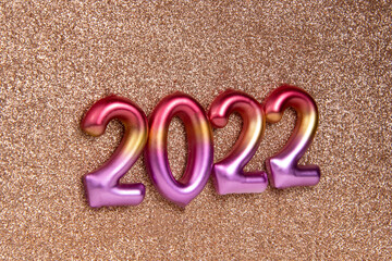 Multicolor creative 2022 numbers on decorative background with copy space