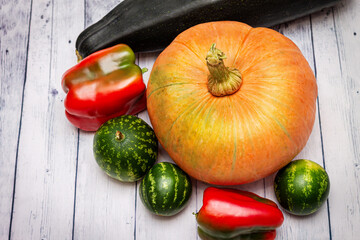 Vegetable harvest close-up on a wooden background.