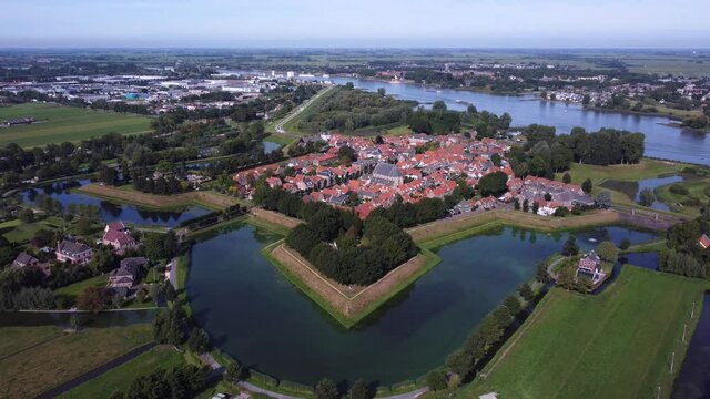 Historic fortress city Nieuwpoort in the Netherlands, Aerial over canal and river Lek