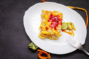 Casserole of zucchini and potatoes with cheese close-up