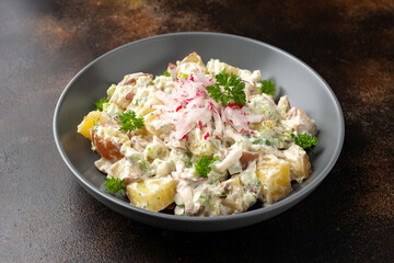 Potato salad with celery, green onion, radish, dill and eggs