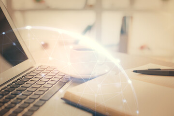 Double exposure of social network drawing and desktop with coffee and items on table background....