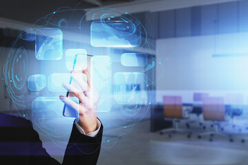 Businesswoman wearing formal suit is holding smartphone in her hand