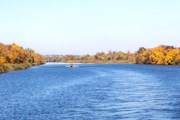 Fototapeta na wymiar big river with yellow trees in autumn