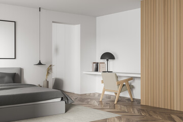 Corner of bedroom with grey bed and white walls with niche desk - obrazy, fototapety, plakaty