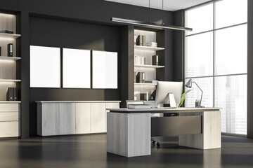 Dark office interior with three empty white poster, panoramic window