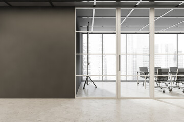 Empty grey wall with meeting room glass door