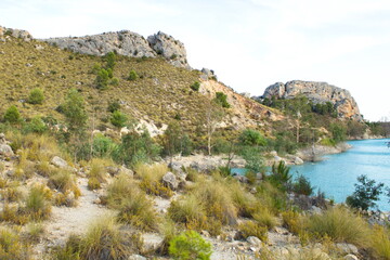 Fototapeta na wymiar Nice inland landscape of Murcia with scrubland and a blue water swamp