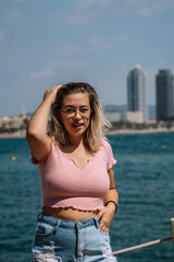 Fototapeta na wymiar young blonde woman posing on the beach